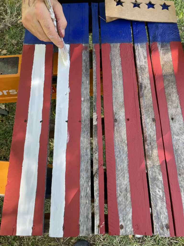 Painting the white stripes between the red stripes