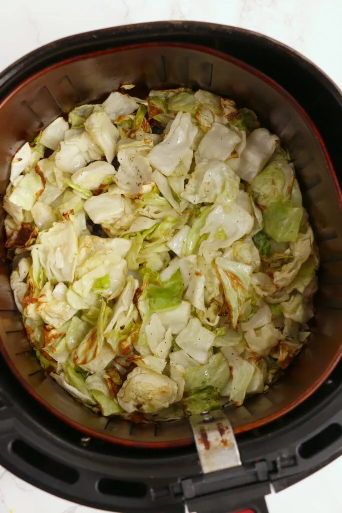 Cooked cabbage in air fryer basket