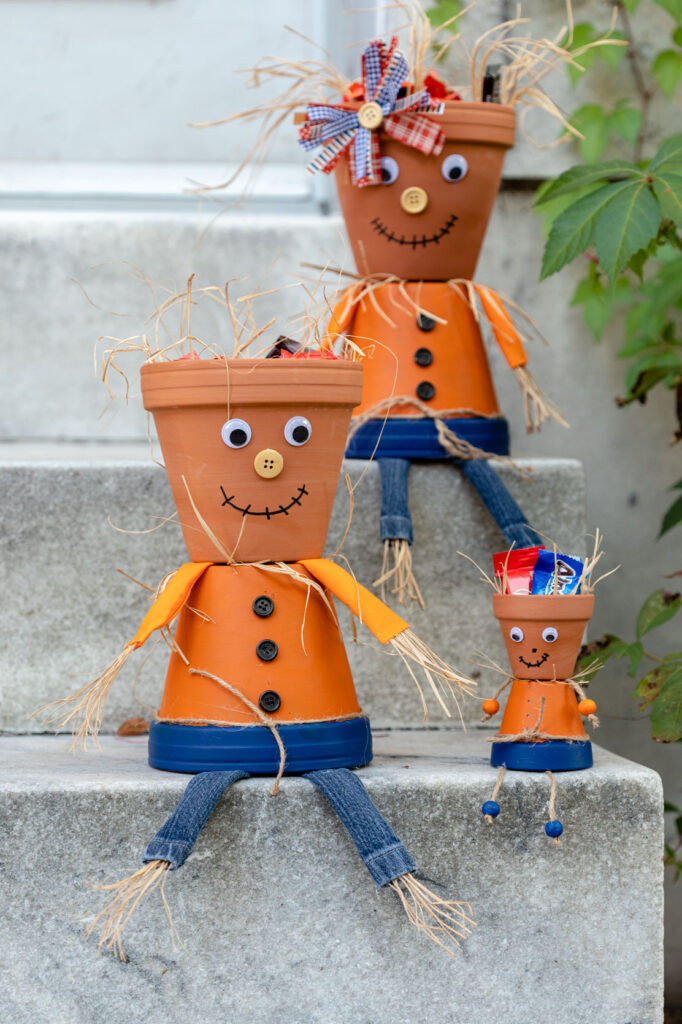 scarecrow candy dishes on the steps outside