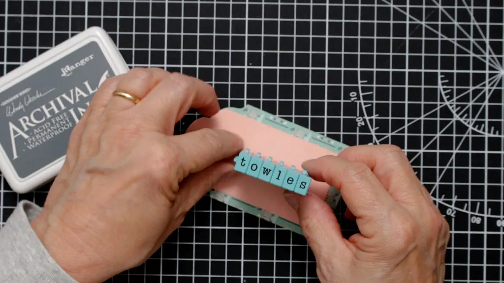 Stamping the tap with letter stamps and ink