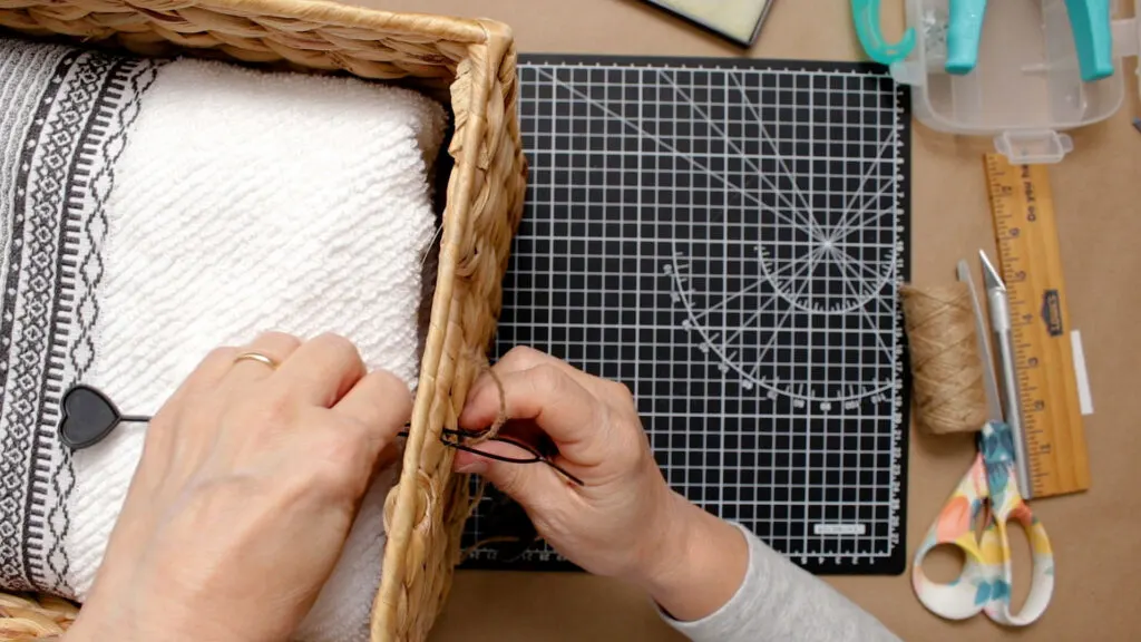 Attaching the tag to a basket with a bead threader