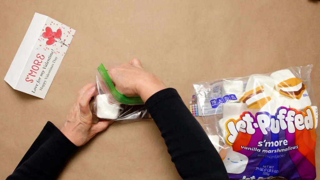 Supplies to create smore's on a table