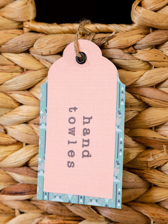 handmade paper tag hanging on a wicker basket