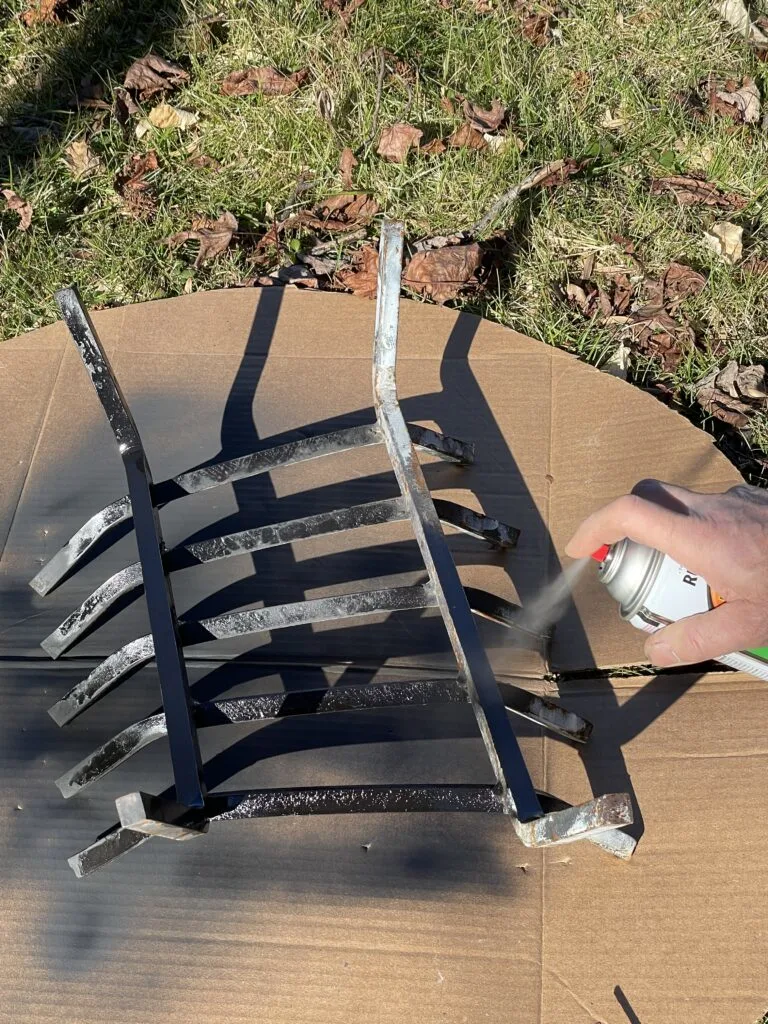 spray painting the wood grate with high heat spray paint