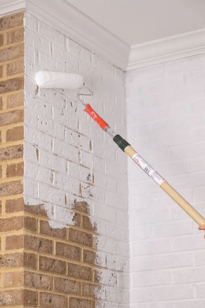 Painting brick with textured roller and extension rod 