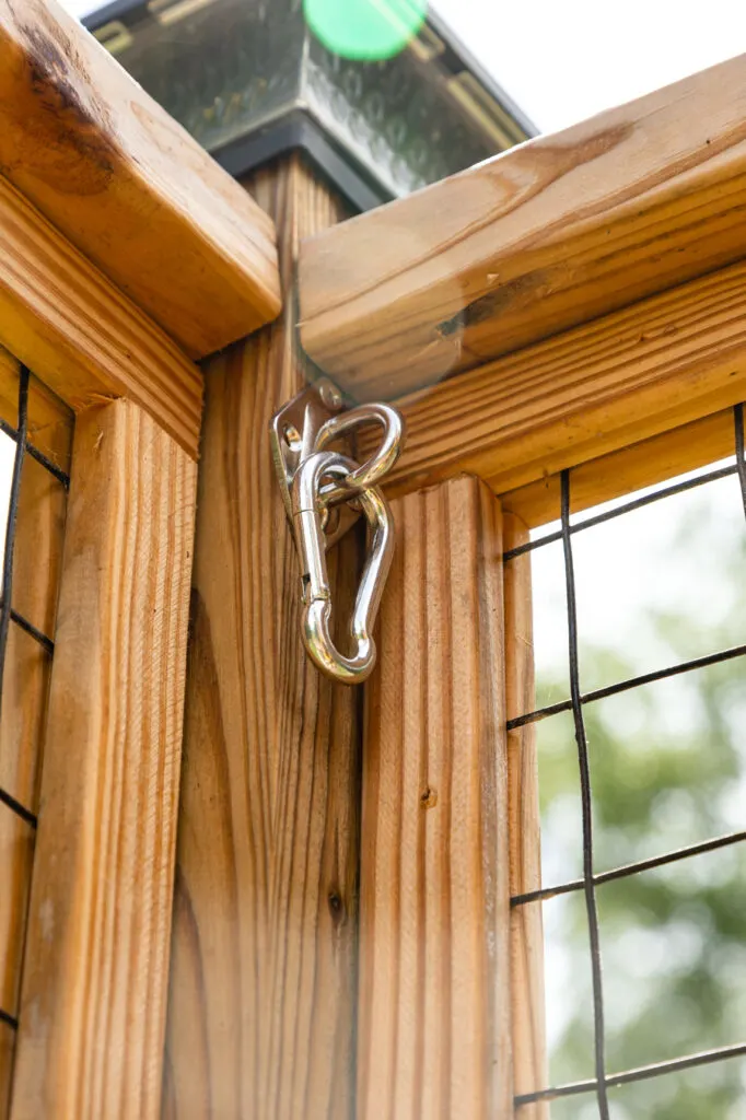 Wood fence with pad eye and snap hook