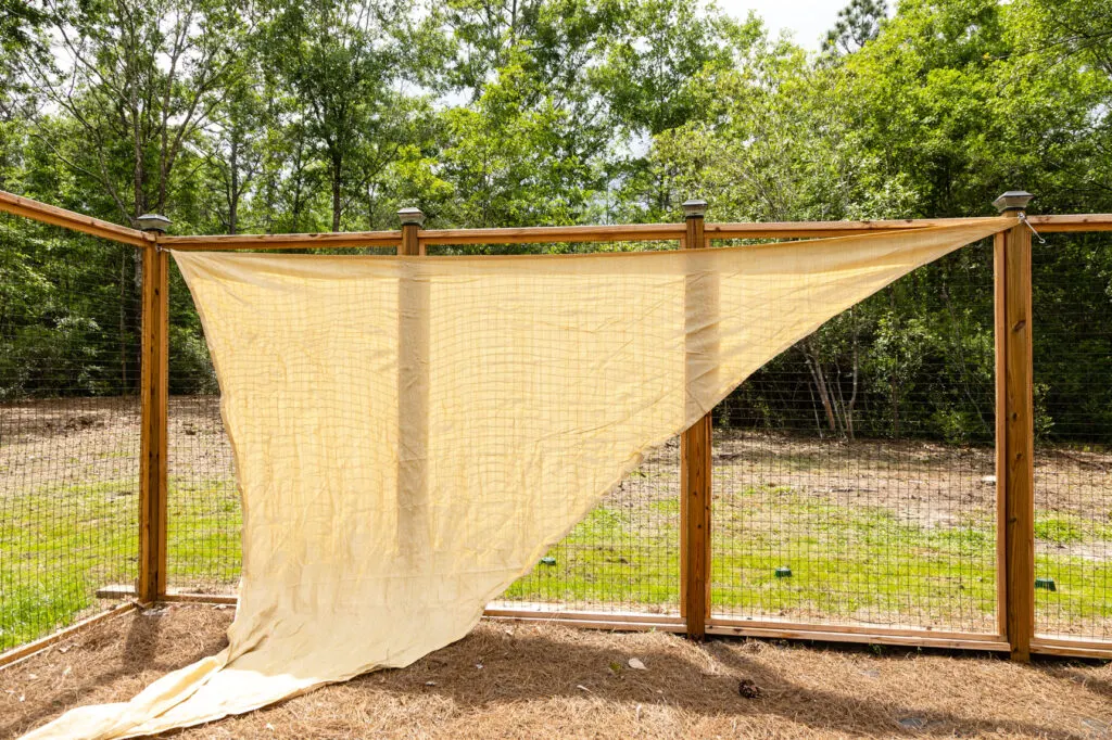 Sail shade installed at two points on the garden posts