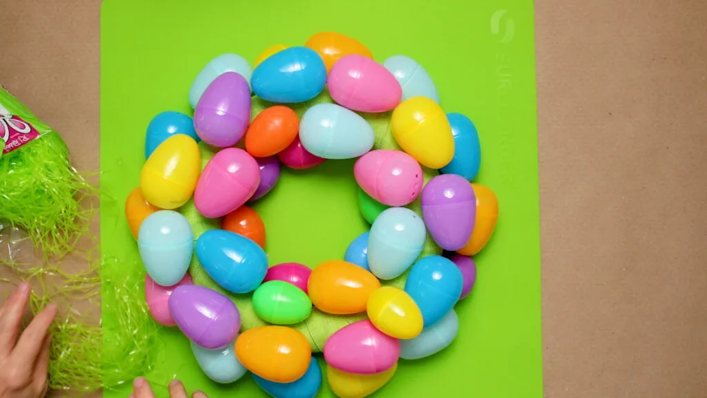 Wreath form covered with plastic Easter eggs