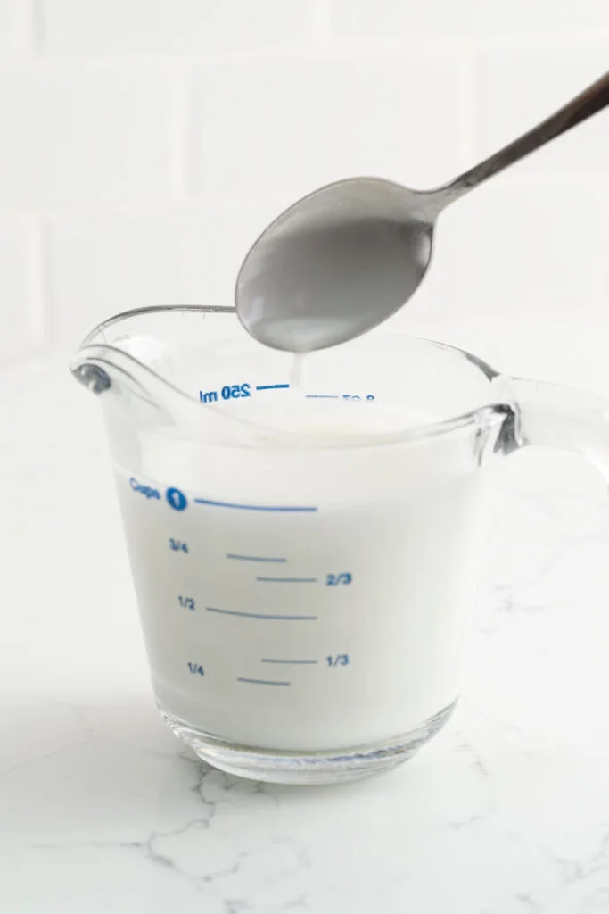 Mixing the cornstarch and water in a Pyrex measuring cup