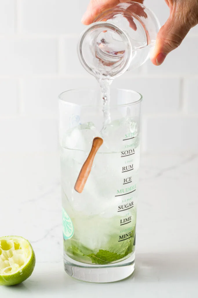 Adding club soda to the mojito 