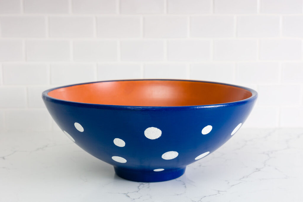 blue pot with white polk dots