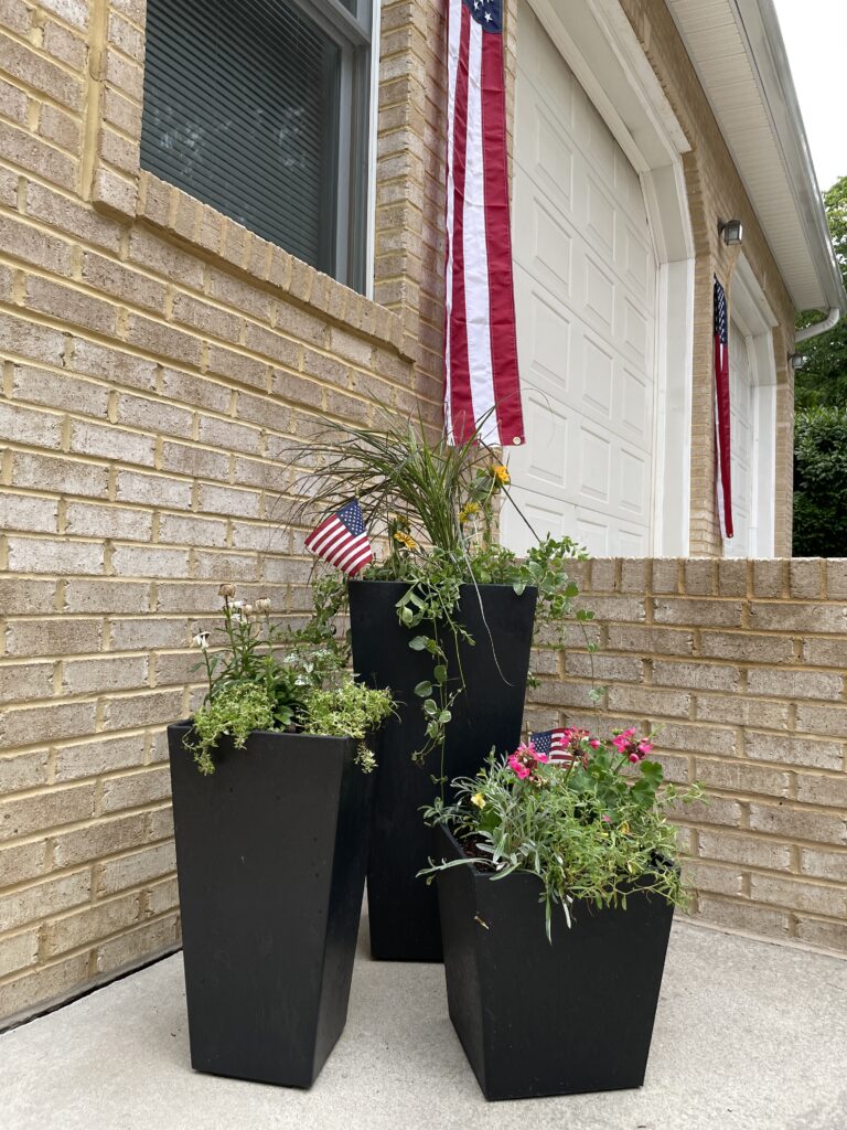 Large Planters filled with flowers and greenery