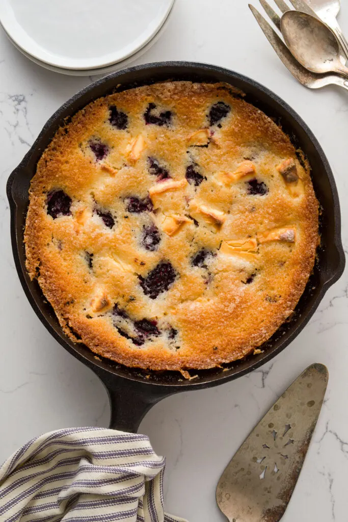 Iron pan with berry dessert on a table