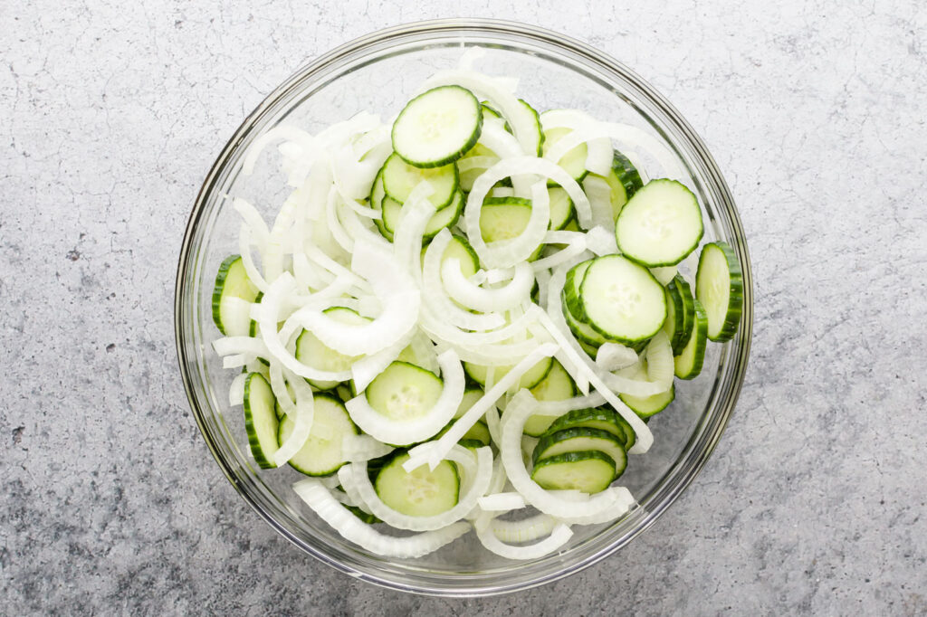 Sliced Cucumber and onions in a bowl