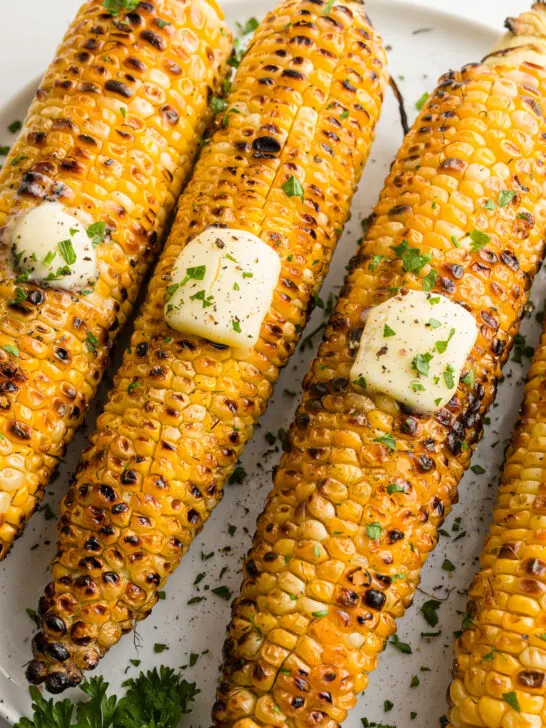 grilled corn on the cob on a plate