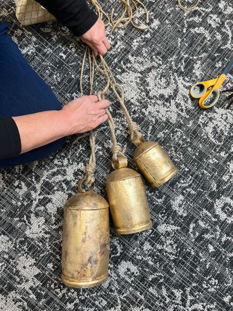 Attaching twine to bells to lengthen them