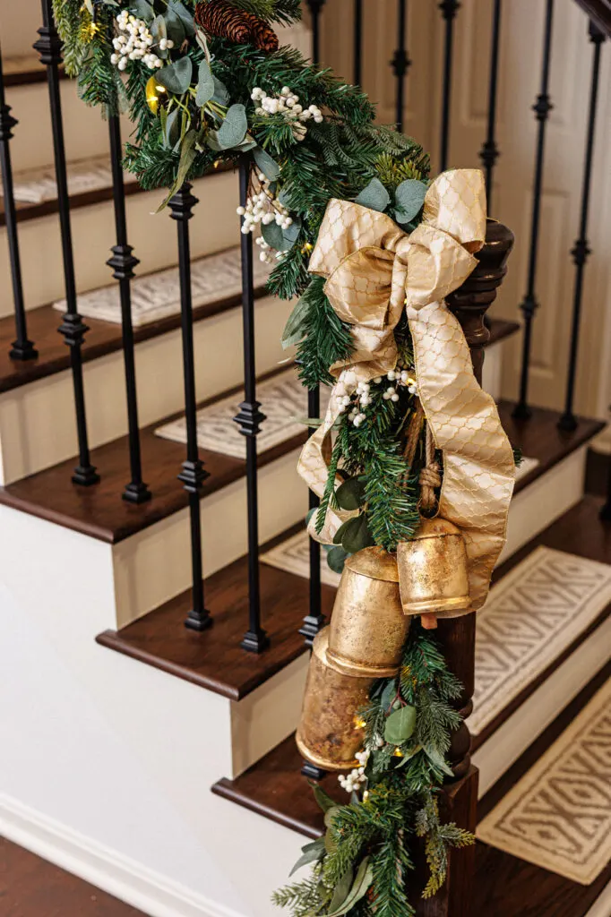 stairway with Christmas greenery, bow and bells