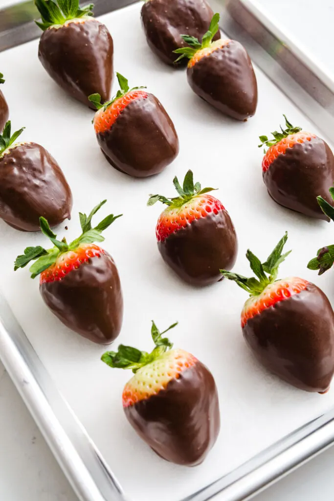 Chocolate covered strawberries on parchment paper