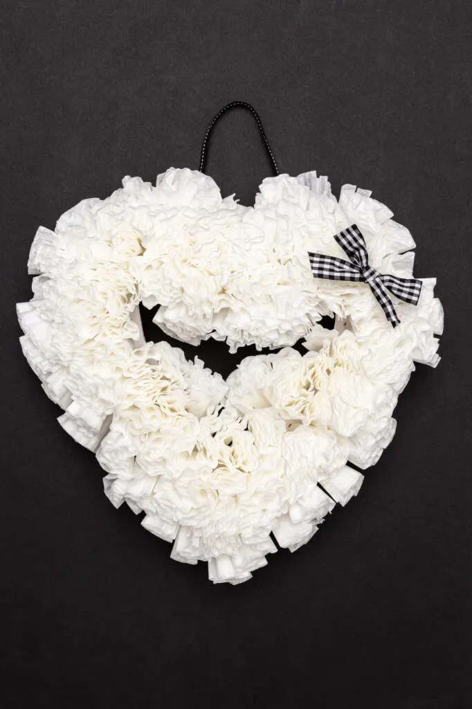 Coffee filter heart on a craft mat