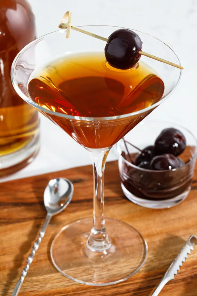 Manhattan cocktail garnished with a cherry
