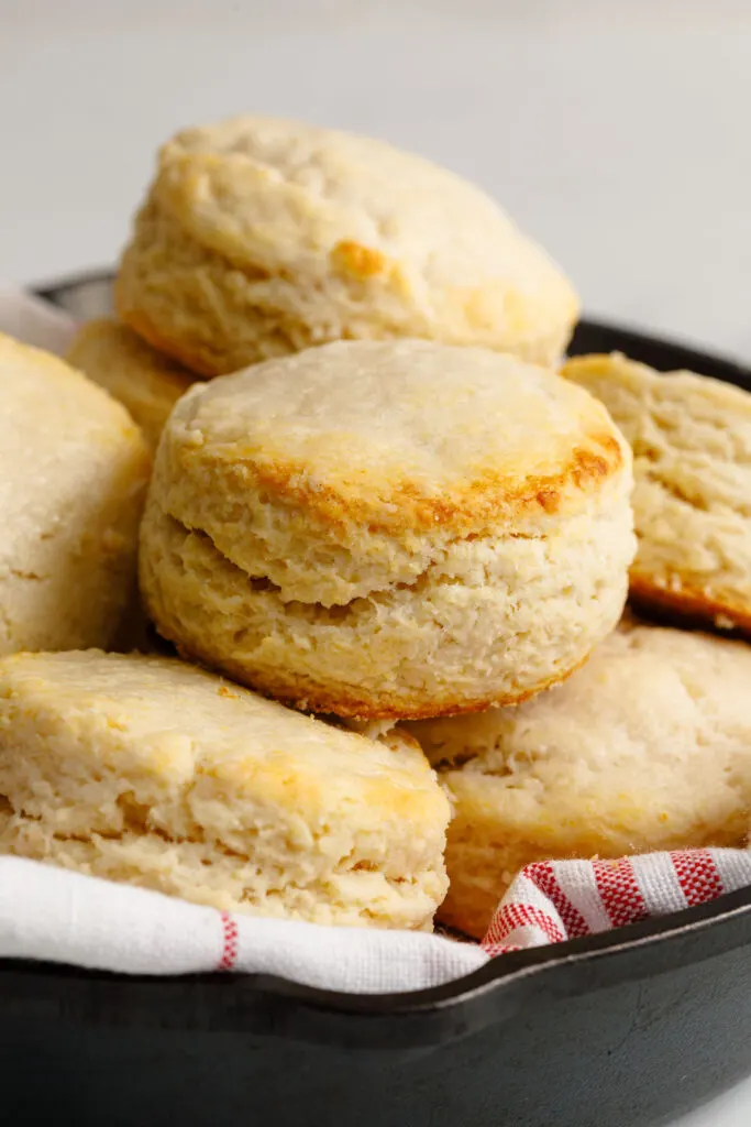 Stacked up homemade biscuits in an iron pan