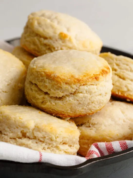 Stacked up homemade biscuits in an iron pan