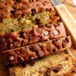sliced chocolate chip banana bread on a cutting board