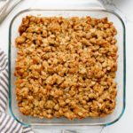 Dish of baked apple crisp on a counter