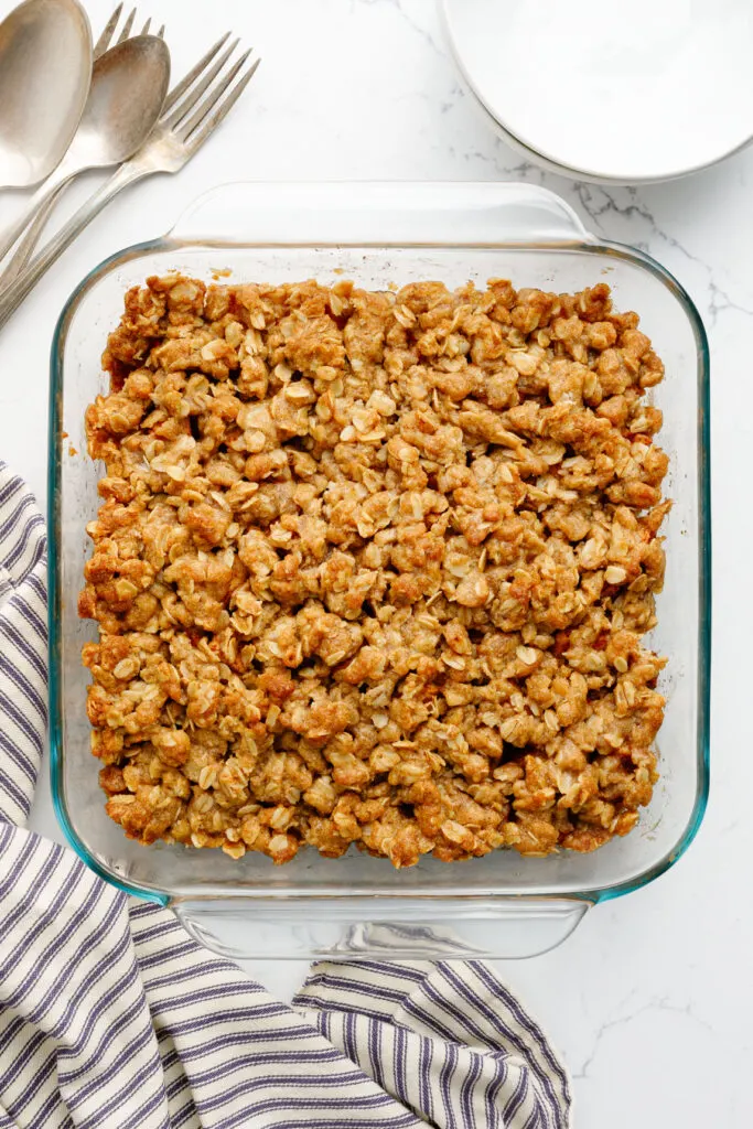 Dish of baked apple crisp on a counter