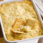 Artichoke Dip in a casserole dish on a counter