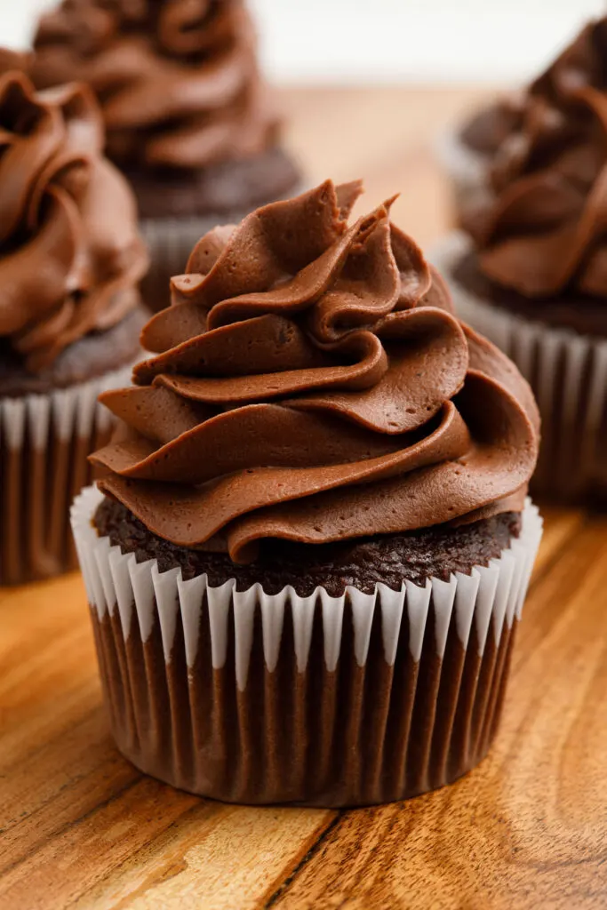 Chocolate buttercream frosting on a chocolate cupcake