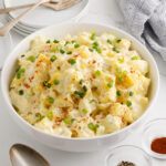 Potato salad with garnish in a serving bowl