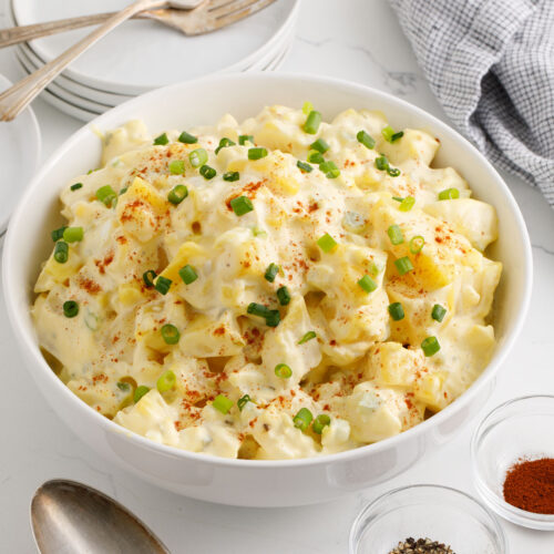 Potato salad with garnish in a serving bowl