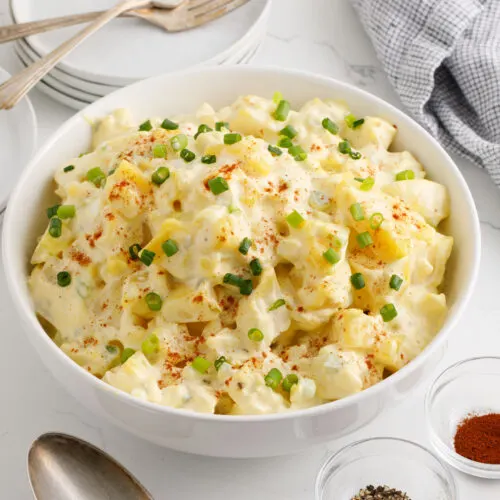 Potato salad with garnish in a serving bowl
