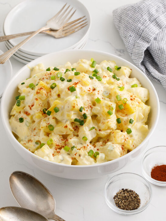 Potato salad with garnish in a serving bowl