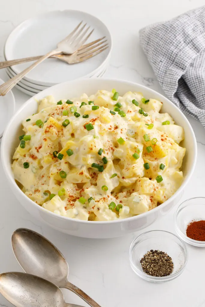 Potato salad with garnish in a serving bowl