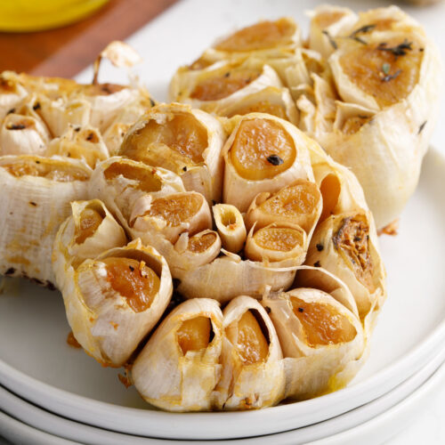 Three roasted blubs of garlic