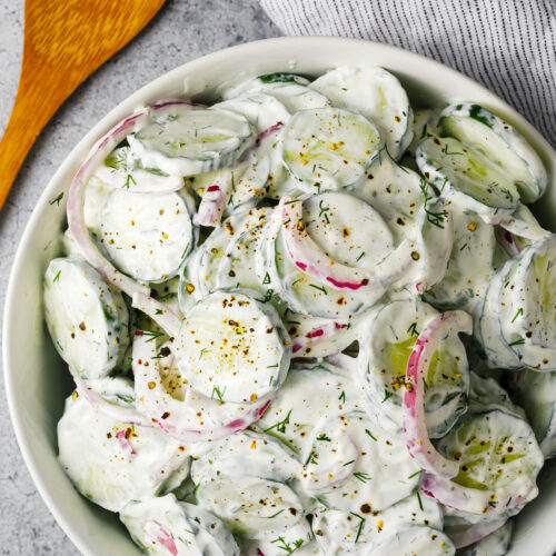 Creamy cucumber salad in a bowl on the counter