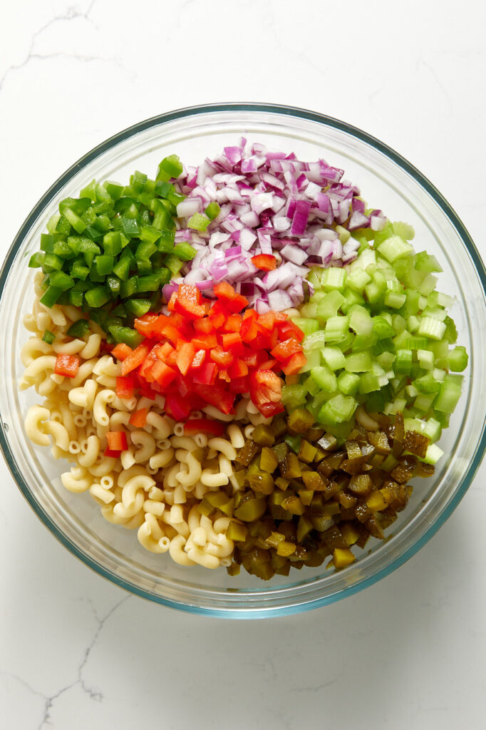 Diced vegetables and macaroni in a bowl