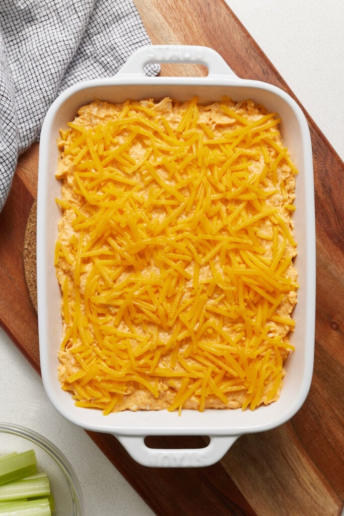 Buffalo chicken dip in a casserole dip ready for the oven