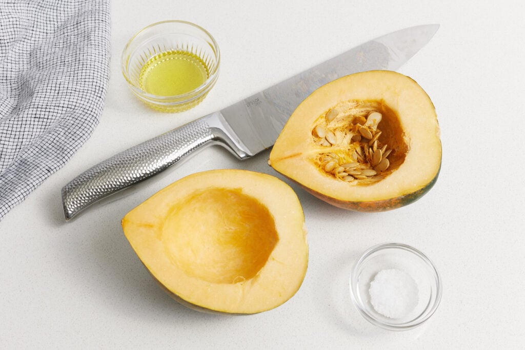 squash cut in half and one half with seeds removed