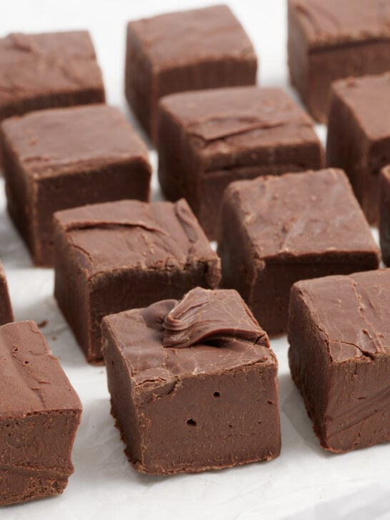 fudge cut into squares on parchment paper
