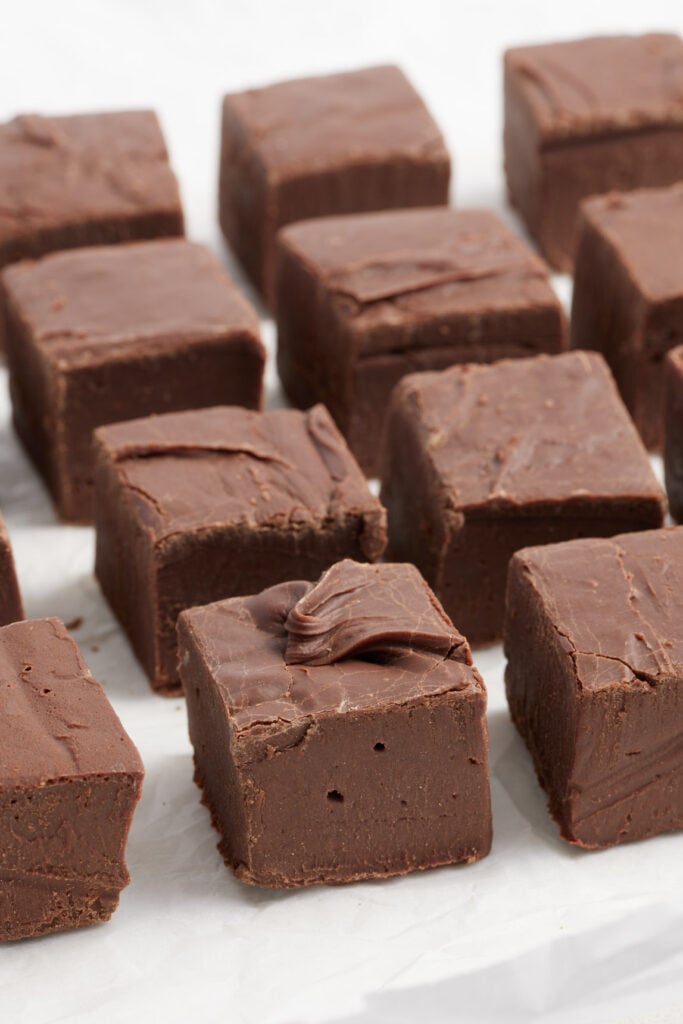 fudge cut into squares on parchment paper