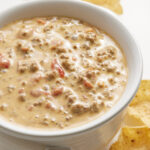 Rotel dip with chips on a table