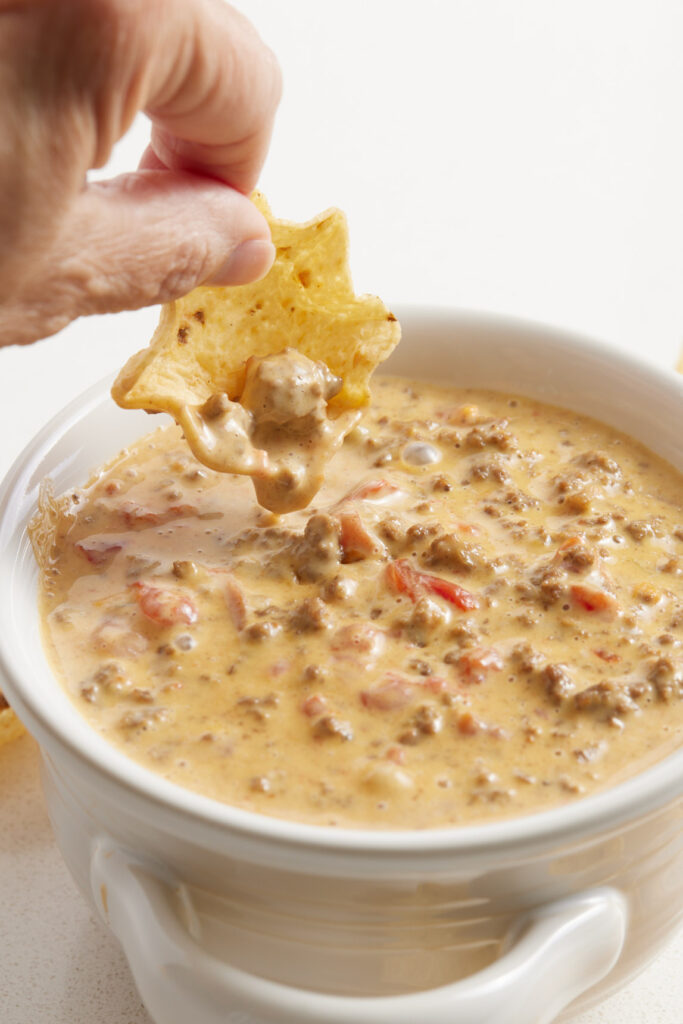 A chip scooping up dip
